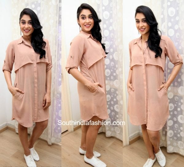 Regina Cassandra in a blush pink shirt dress