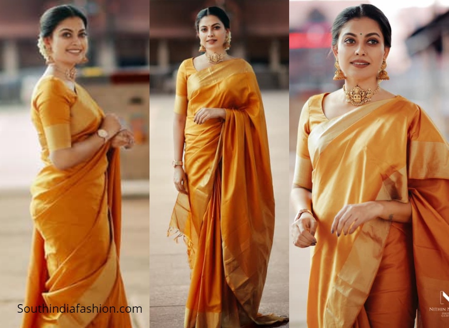 Actress Anusree in golden orange pattu saree in guruvayur