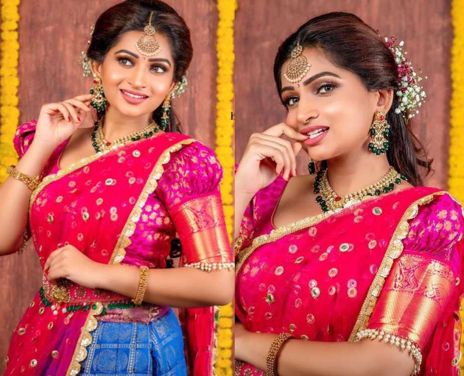 nakshathra nagesh in a pink blue half-saree lehenga look