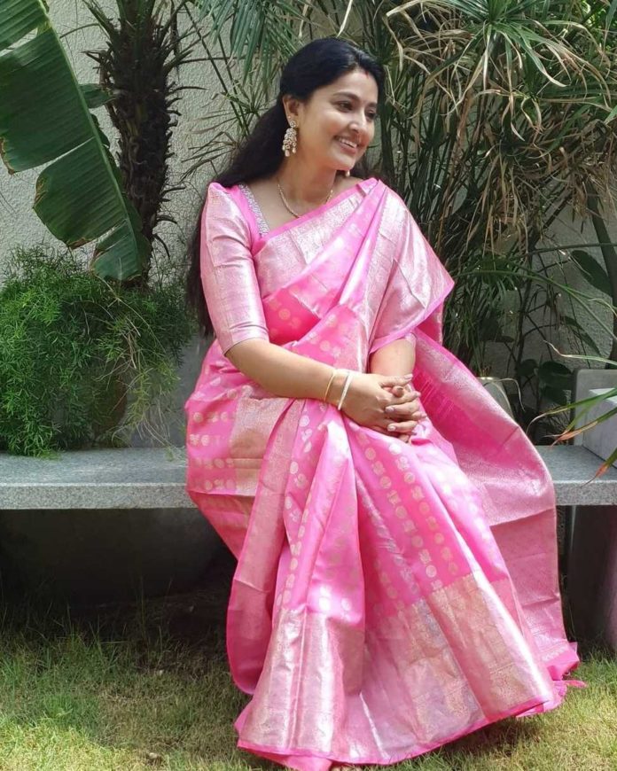 baby pink saree with black blouse