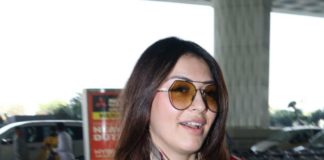 Hansika Motwani in a blue jeans-red jacket at Hyderabad airport4