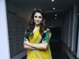 Krithi shetty in a yellow half saree with green blouse for uppena pre-release event3