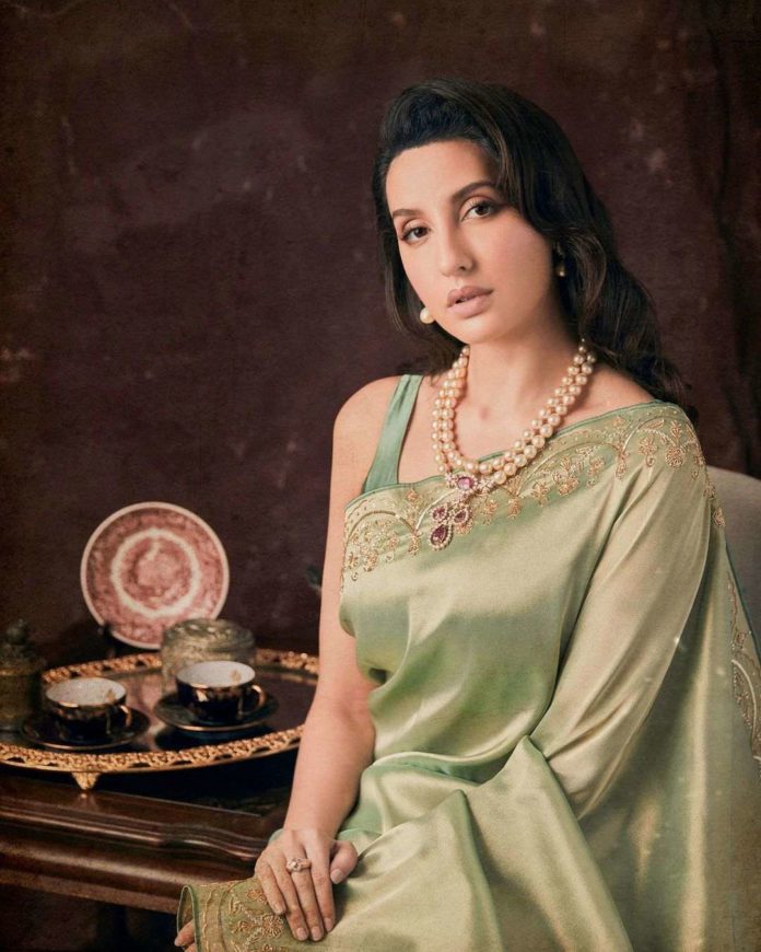 Nora Fatehi exudes elegance in a pista saree for DSPIFF awards'21!