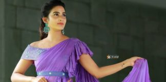 aditi ravi in a light purple ruffled saree with belt