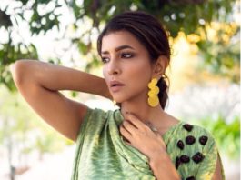 lakshmi manchu in a green yellow cowl top