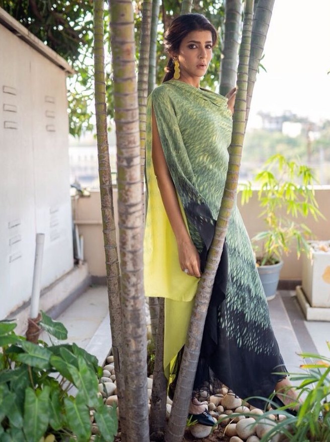 lakshmi manchu latest pics in a green and yellow cowl top