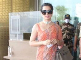 kangana ranaut in a light orange saree at airport