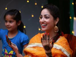 Yami Gautam in an orange kurta set for her mehendi