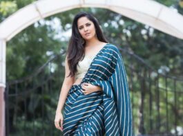 Anasuya Bharadwaj in navy blue saree by Vaasavi couture for Jabardasth