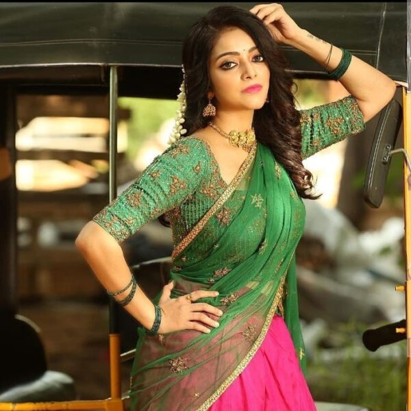 Janani Iyer in a pink and green half saree!