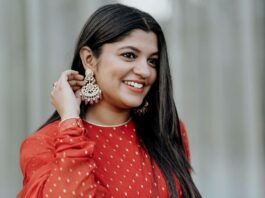 Aparna Balamurali in a red anarkali by shemy for a wedding