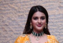 Niddhi agerwal in a yellow lehenga by paulami and adarsh for hero pre release-1