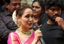 pragya jaiswal in a green saree at a shop opening4