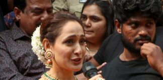 pragya jaiswal in a green saree at a shop opening4